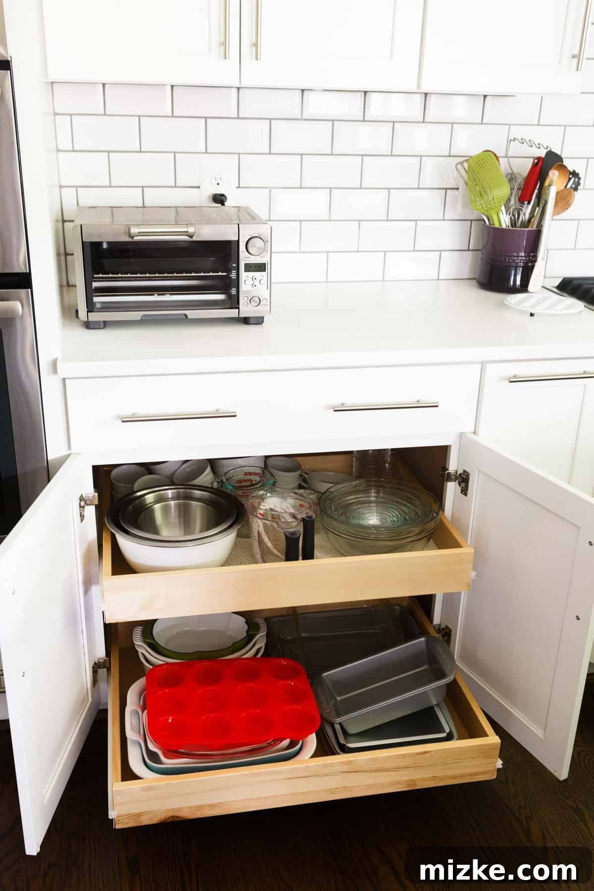 Welcome to My Kitchen 13 Kitchen cabinets featuring convenient pull-out drawers for easy access and efficient storage of kitchen items.