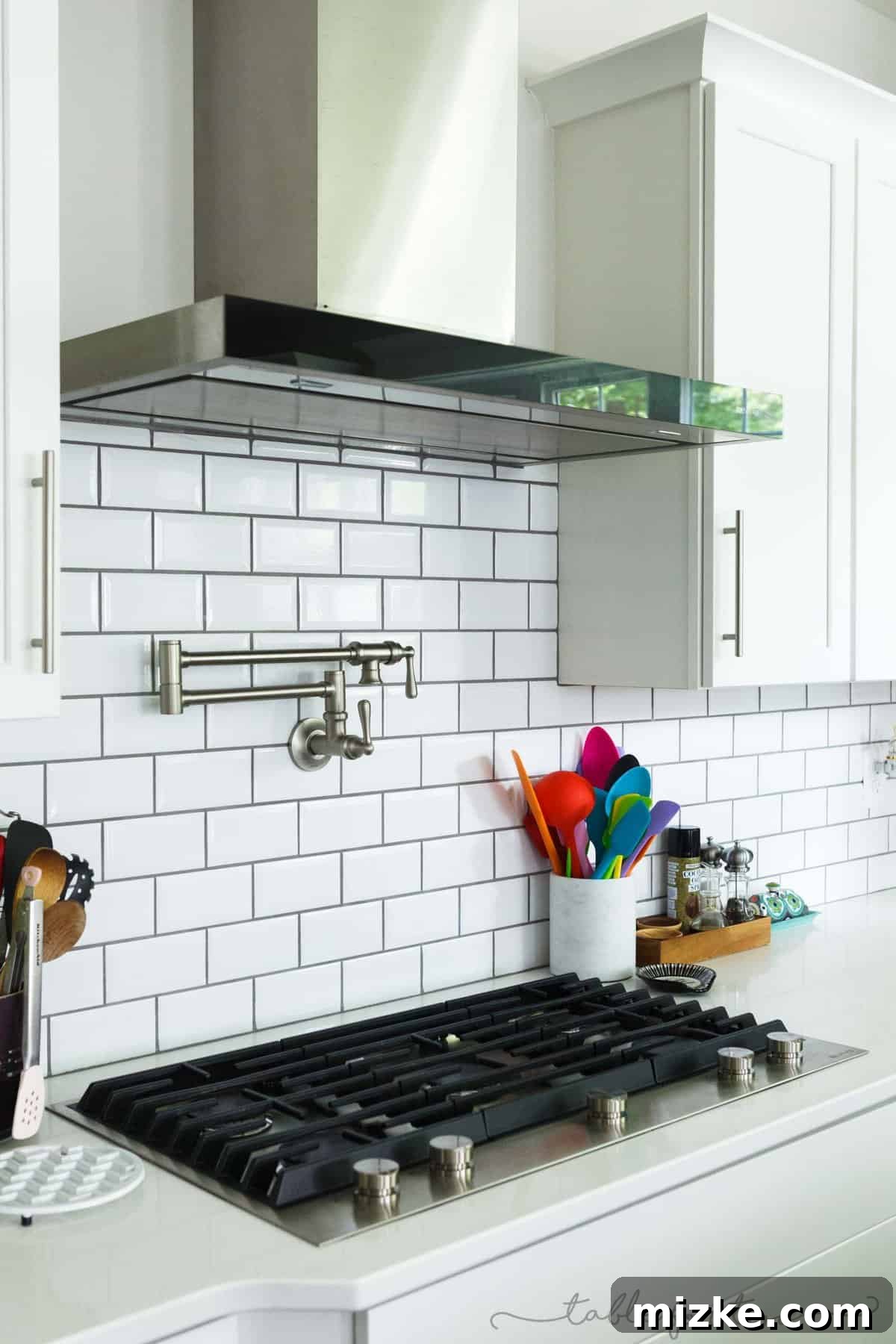 Welcome to My Kitchen 6 A sleek pot filler faucet installed above a modern range, highlighting kitchen convenience and thoughtful design.