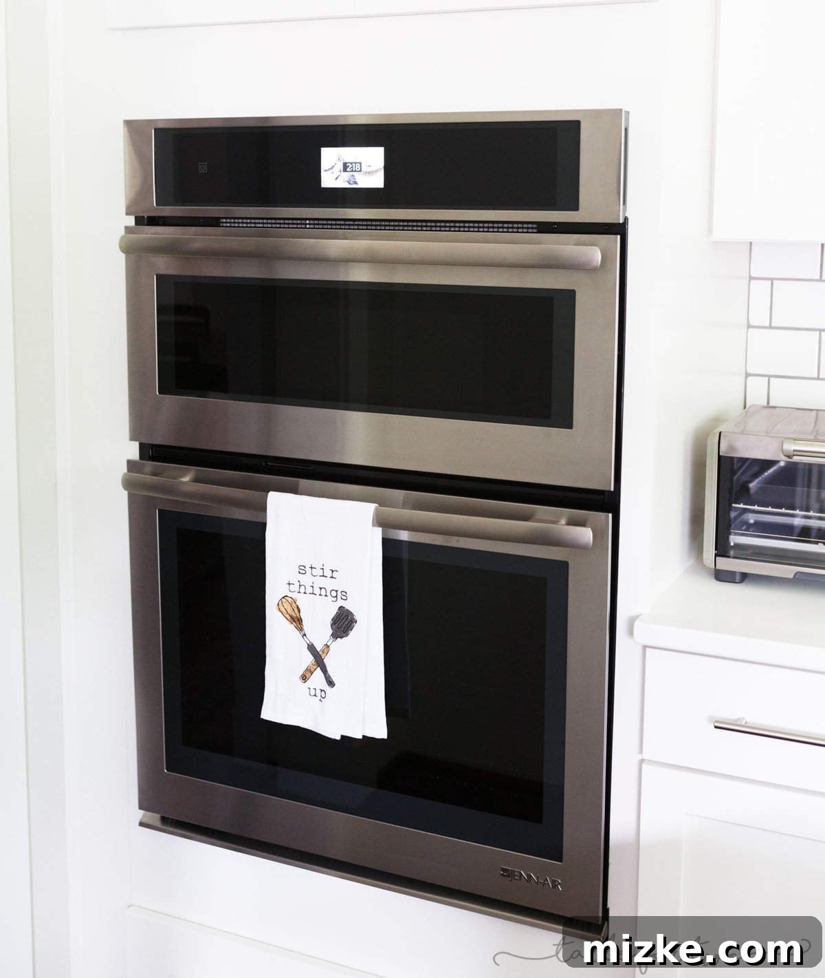 Welcome to My Kitchen 8 Integrated double oven and microwave combo unit with digital touchscreens in a modern white kitchen.