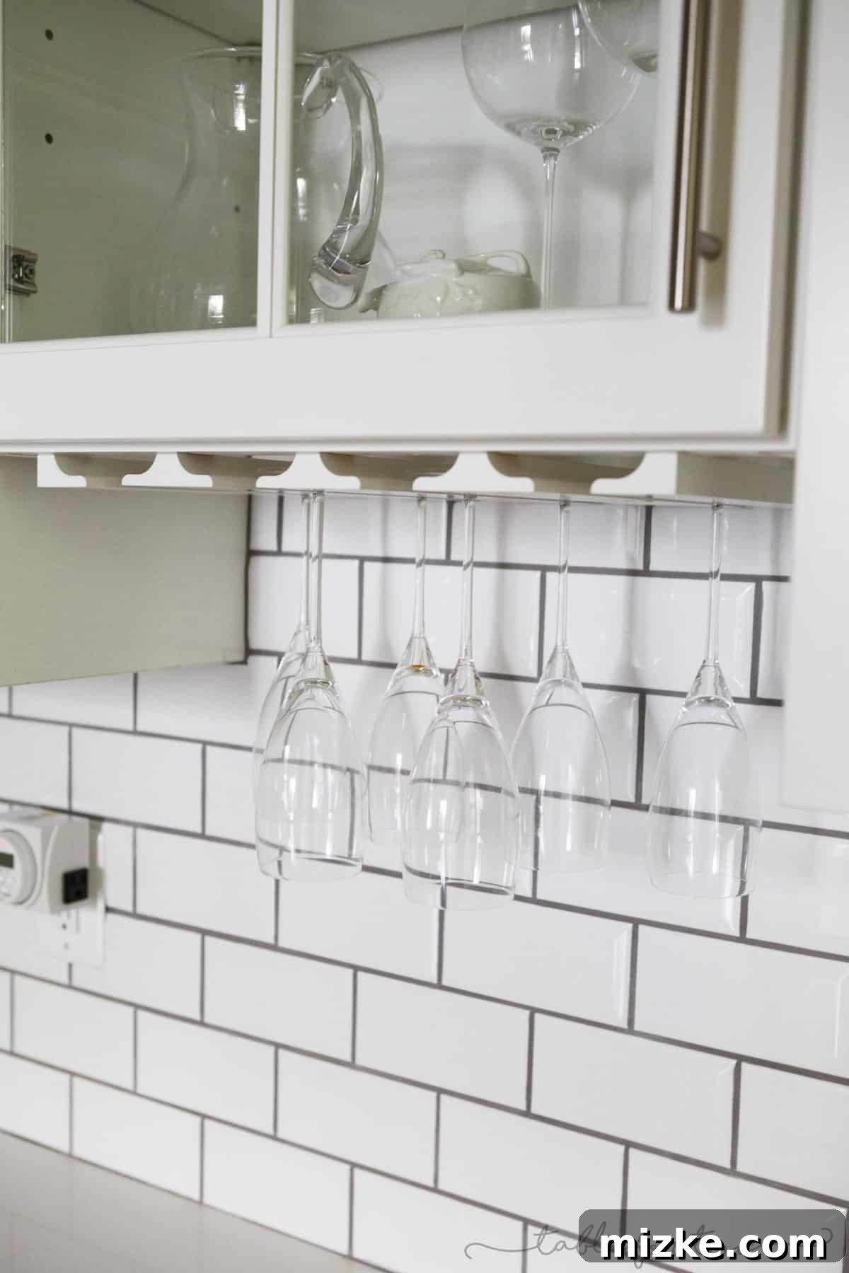 Welcome to My Kitchen 10 Close-up of elegant stemware holders installed in a butler's pantry, showcasing sophisticated storage.