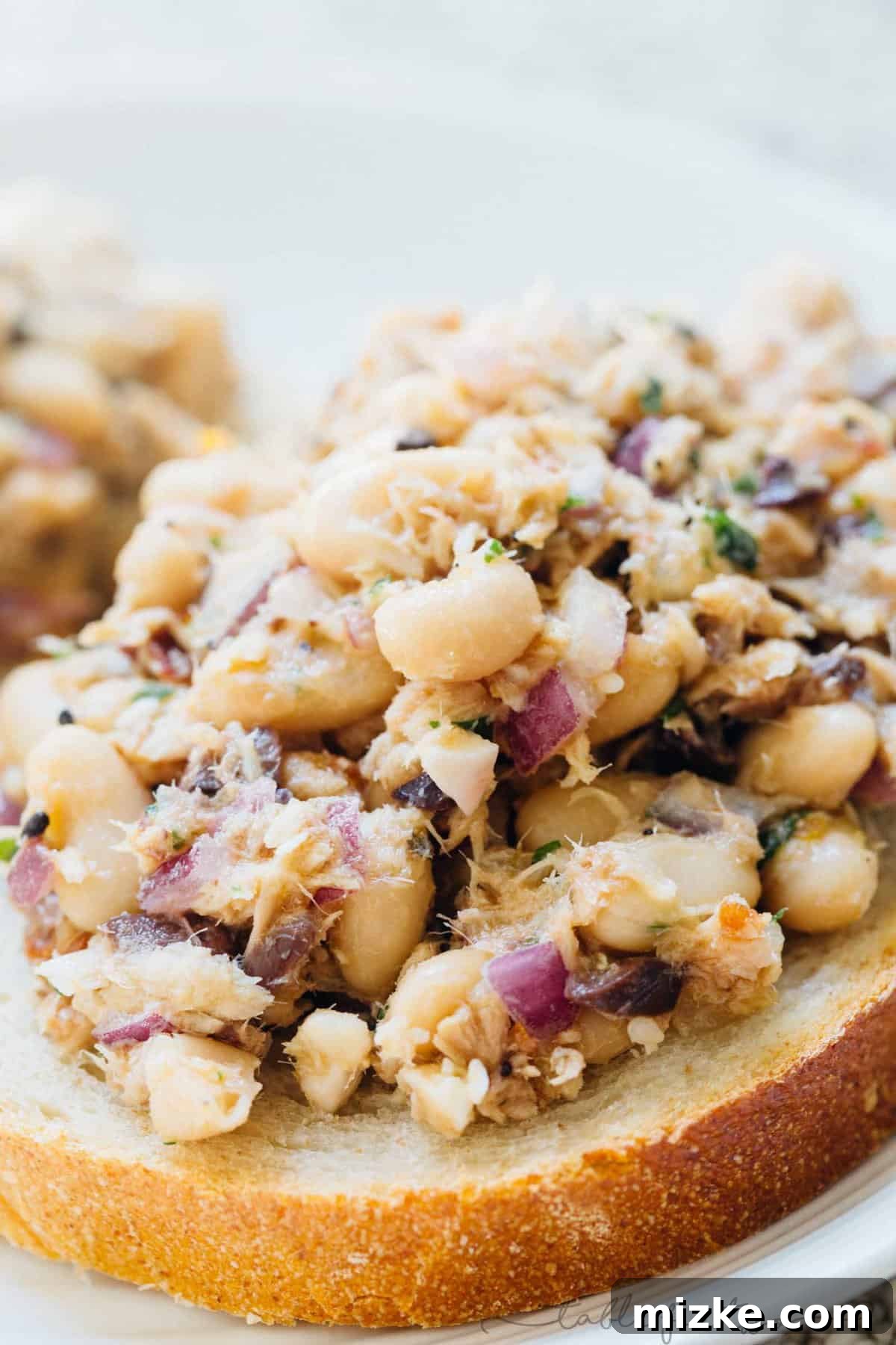 Bright Mediterranean Tuna & White Bean Salad 7 Another view of the generously portioned Mediterranean tuna white bean salad in a bowl, ready to be enjoyed.