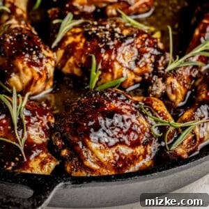 Caramelized Fig Chicken Skillet 10 A static image of a rosemary-garnished fig glazed chicken, representing the recipe card thumbnail.
