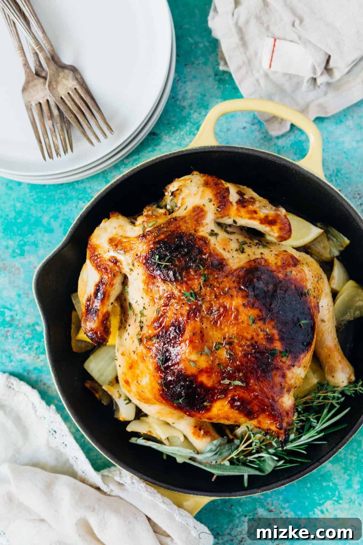 Honey Butter Herb Roasted Pressure Cooker Chicken 2 A perfectly golden-brown pressure cooker honey butter and herb roasted chicken, served whole on a platter with fresh herbs, ready for a festive Thanksgiving meal.