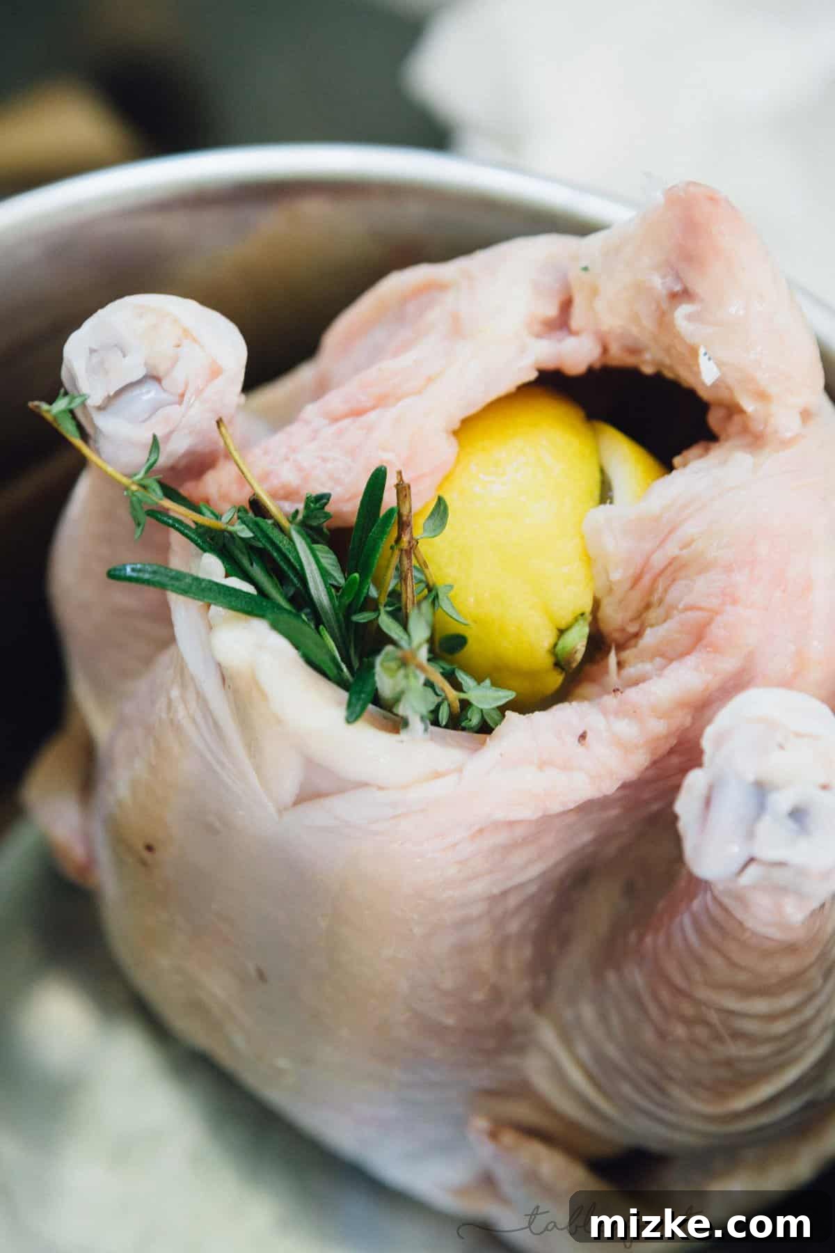 Honey Butter Herb Roasted Pressure Cooker Chicken 4 Fresh aromatic poultry herbs, quartered onion, and lemon halves are carefully stuffed into the cavity of a whole chicken, infusing it with flavor from within.