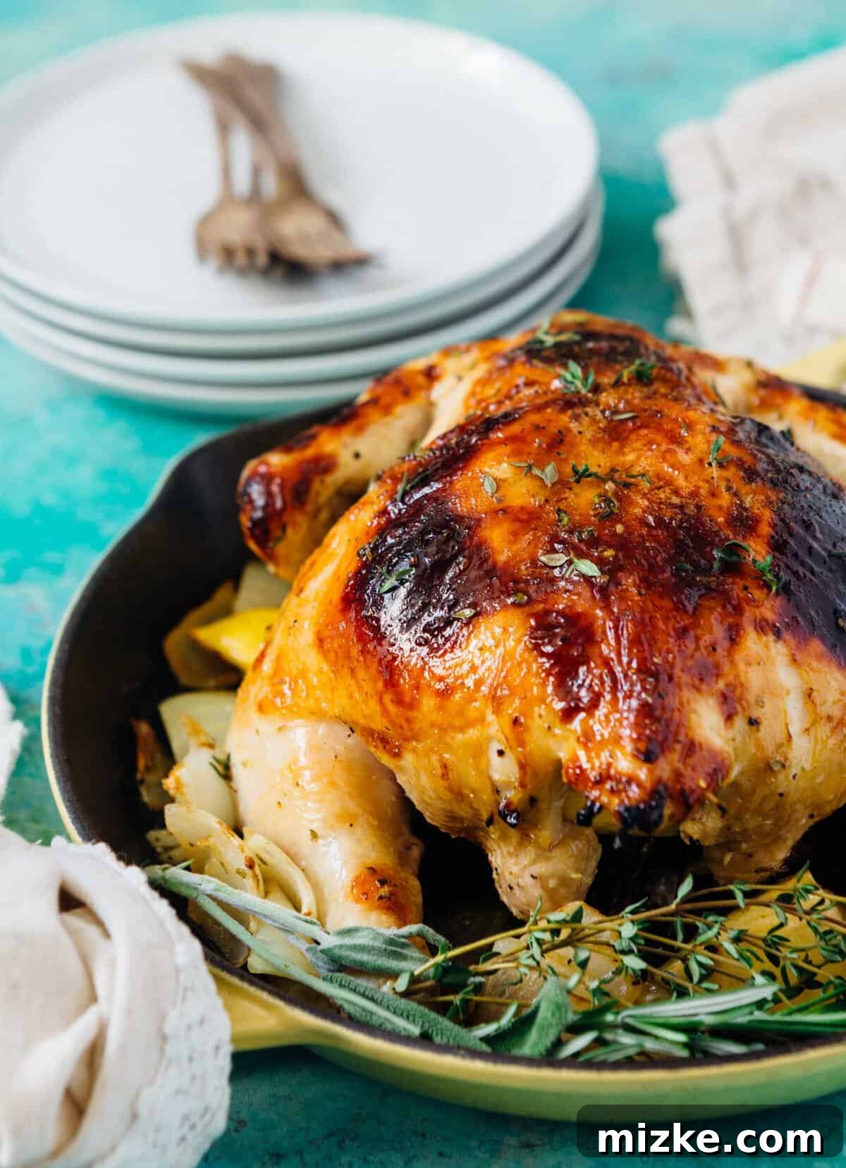 Honey Butter Herb Roasted Pressure Cooker Chicken 6 A close-up view of the honey butter and herb roasted chicken's irresistibly crispy, golden-brown skin, showcasing the rich glaze and tantalizing texture.