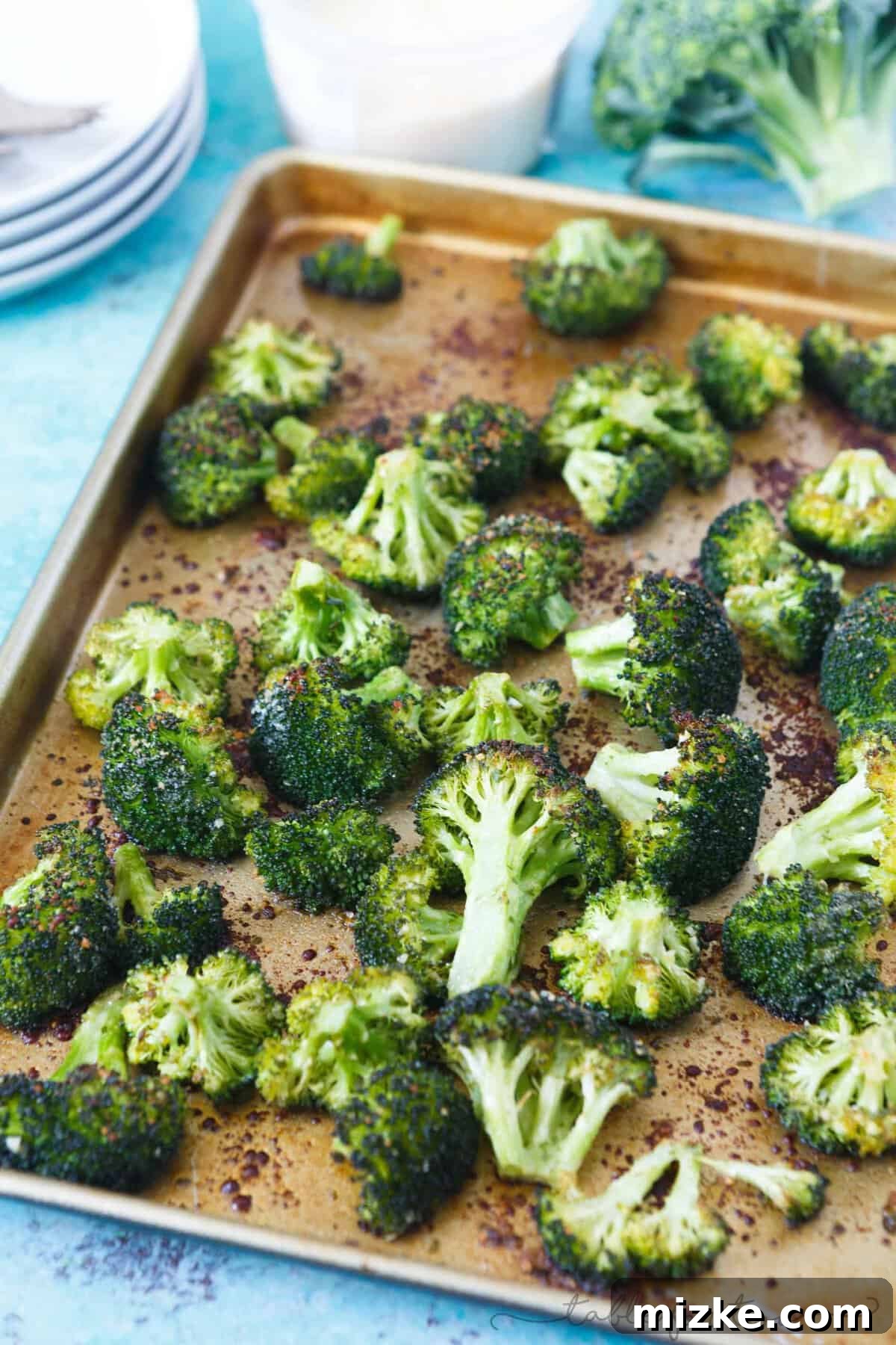 Parmesan-Crusted Roasted Broccoli 2 Close-up of golden-brown roasted parmesan broccoli florets with crispy edges, ready to serve as a side dish.
