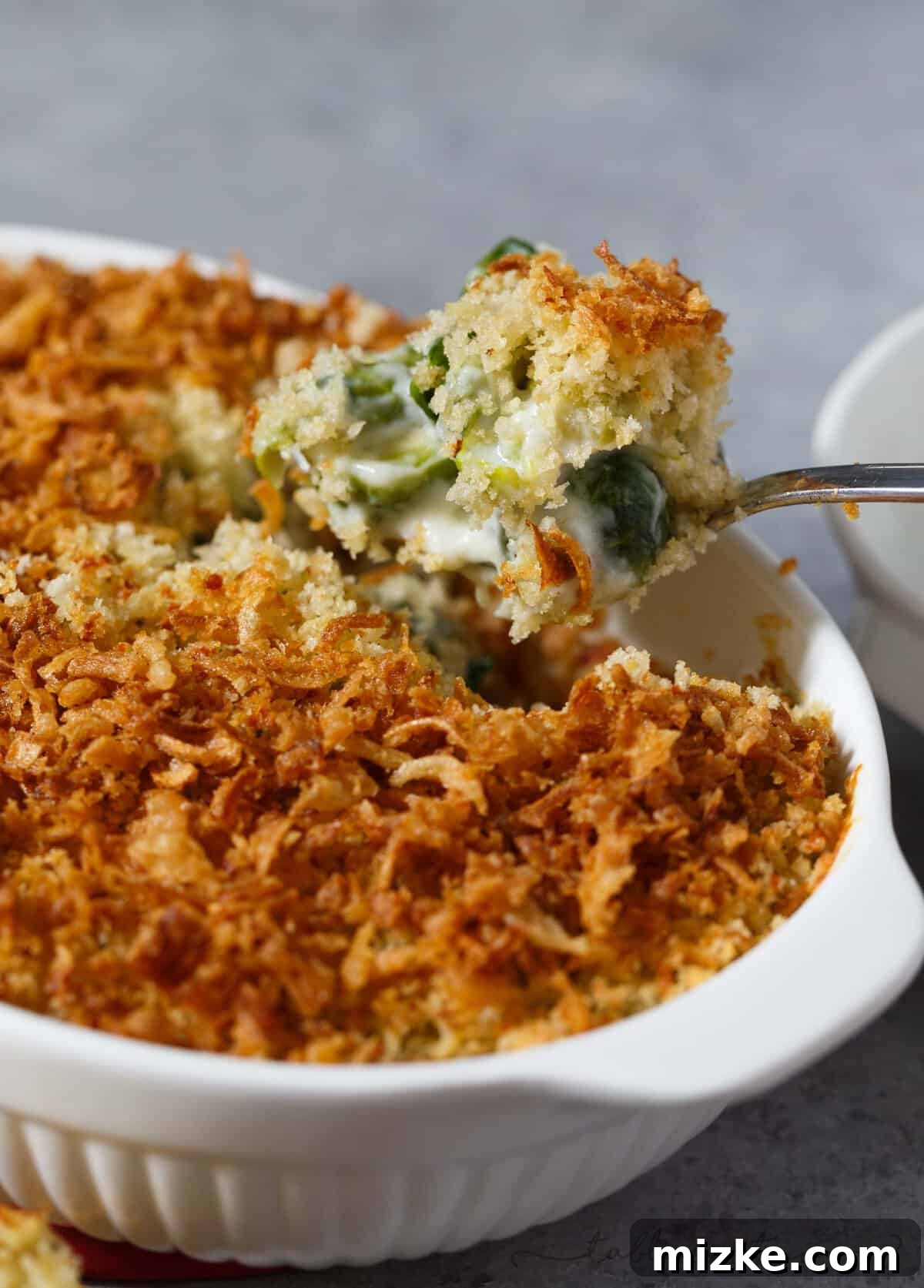 Golden Roasted Brussels Sprouts Gratin 2 A beautifully golden-brown roasted Brussels sprouts gratin with a crunchy garlic crumble and crispy onion topping, ready to be served.