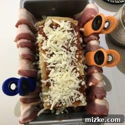 Bacon Blanket Lasagna Bake 7 Lining a loaf pan with bacon, with ends hanging over the sides.