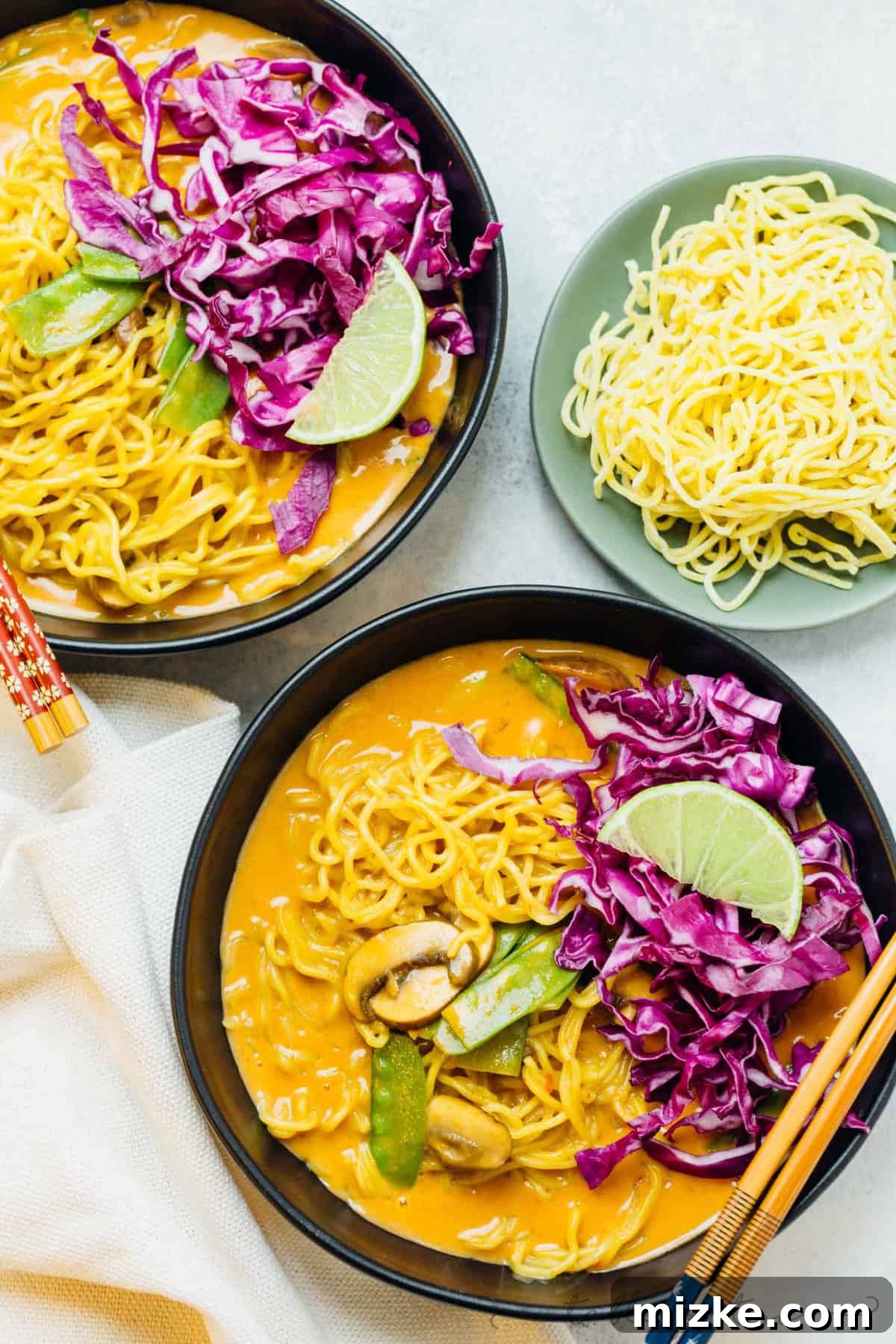 Luscious Coconut Curry Ramen 2 A vibrant, steaming bowl of Coconut Curry Ramen, generously garnished with fresh herbs and crisp vegetables, ready to warm you from the inside out.