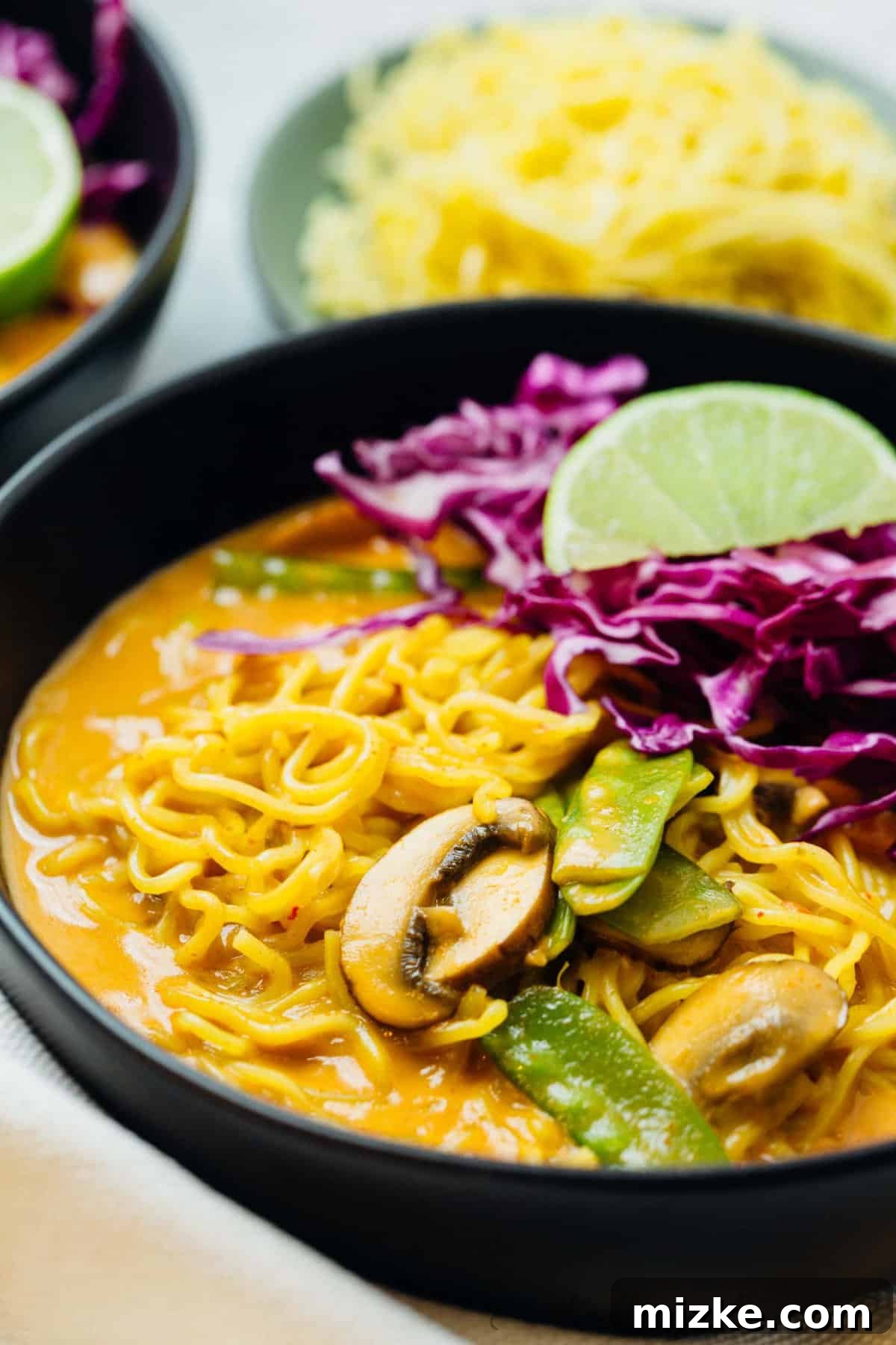 Luscious Coconut Curry Ramen 4 A beautifully composed flat lay of Coconut Curry Ramen, showcasing its enticing colors, fresh ingredients, and readiness for enjoyment.