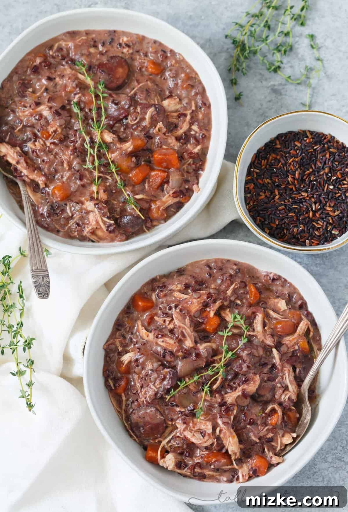 Velvety Instant Pot Chicken Mushroom Wild Rice Stew 3 Overhead shot of a pot filled with carrots, onions, mushrooms, wild rice, and chicken breasts, ready to be cooked in the Instant Pot.