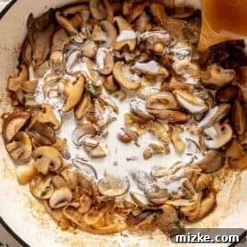Velvety Mushroom Chicken 8 Sliced mushrooms and onions sautéing in a skillet as a hand pours broth into the pan.