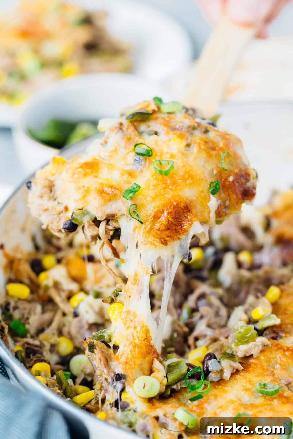 Instant Pot pork poblano skillet enchiladas are full of flavor and put together fairly easily for a crowd pleasing meal! #instantpot #pressurecooker #instantpotrecipe #instantpotpork #porkrecipe #porkpoblano #skilletenchiladas