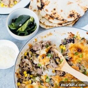 Instant Pot pork poblano skillet enchiladas are full of flavor and put together fairly easily for a crowd pleasing meal! #instantpot #pressurecooker #instantpotrecipe #instantpotpork #porkrecipe #porkpoblano #skilletenchiladas