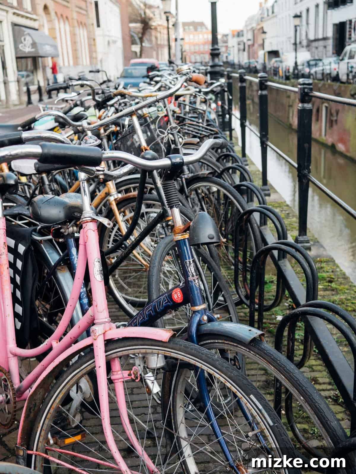Utrecht: Discovering the Netherlands' Vibrant Heart 3 Picturesque Utrecht canals featuring historic wharf cellars and charming waterfront cafes, an ideal spot for a relaxing day trip.
