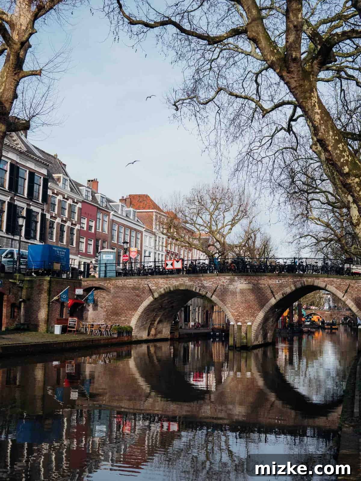 Utrecht: Discovering the Netherlands' Vibrant Heart 8 The enchanting reflection of historic buildings on Utrecht's calm canal waters, showcasing its unique and captivating beauty.