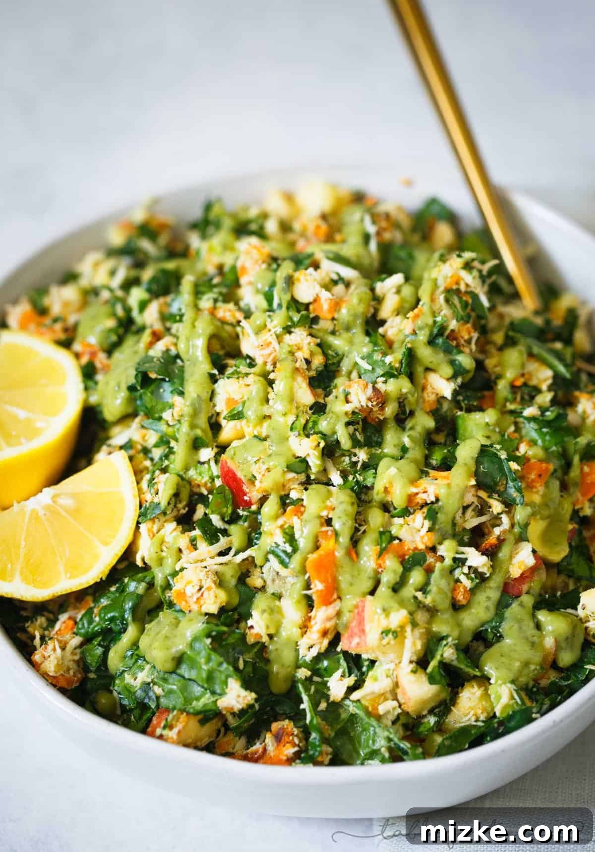 Hearty & Flavorful Harvest Chopped Salad Bowl: A Perfect Sweetgreen Copycat Lunch Idea A vibrant and hearty Harvest Chopped Salad Bowl with roasted sweet potatoes, kale, chicken, apples, and almonds, perfect for a clean and satisfying lunch.