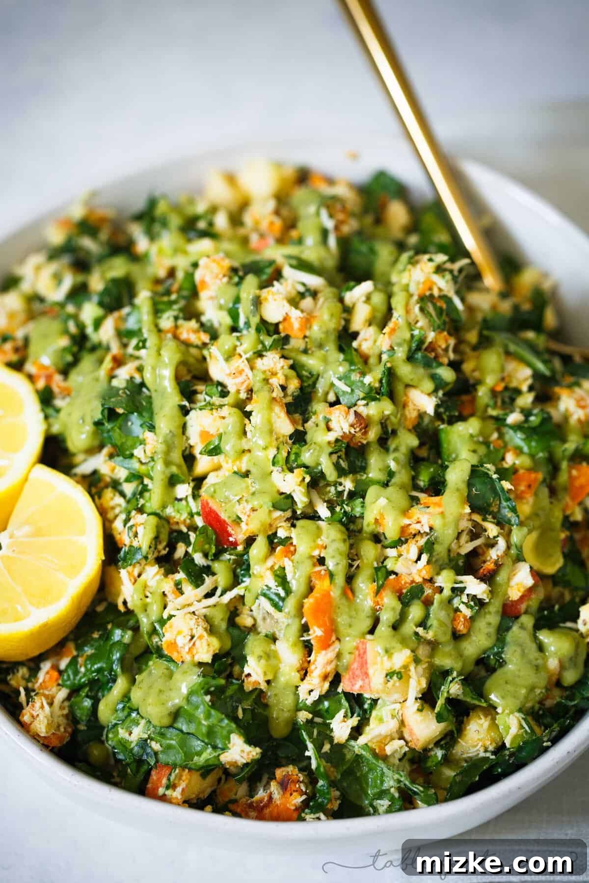 Make Your Own Healthy & Filling Harvest Chopped Salad for Meal Prep or Quick Lunch A beautifully presented Harvest Chopped Salad Bowl, highlighting the colorful medley of roasted sweet potatoes, green kale, red apples, and white shredded chicken.