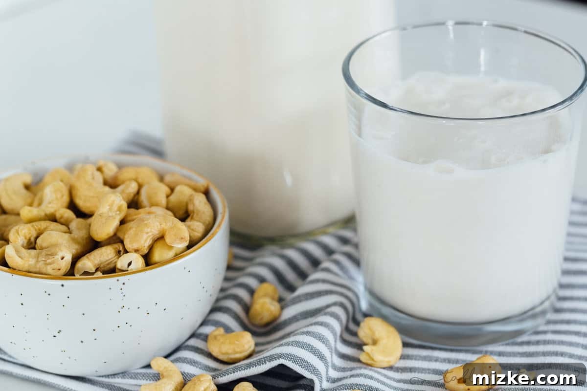 Storing your fresh homemade cashew milk in stylish glass bottles. Four pristine glass bottles neatly arranged, filled to the brim with freshly prepared homemade cashew milk, indicating proper storage and a satisfying batch.