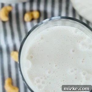 Homemade Creamy Cashew Mylk 2 Close-up of freshly prepared homemade cashew milk in a glass, highlighting its smooth, creamy texture and appealing white color.