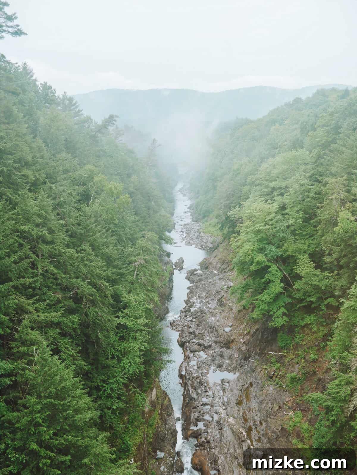 Your Ultimate Guide to Woodstock Vermont 16 Panoramic view of Quechee Gorge from the bridge, showcasing the river below and lush forests