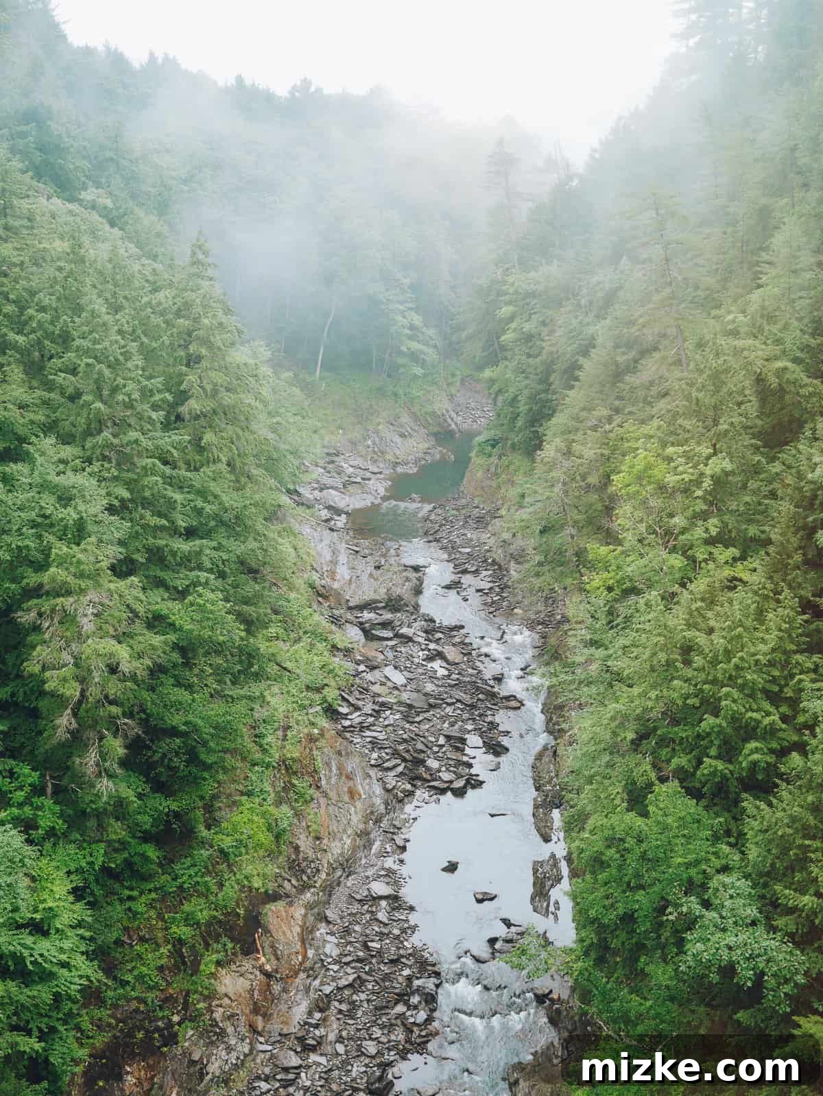 Your Ultimate Guide to Woodstock Vermont 17 Closer view of the dramatic rock formations and flowing water within Quechee Gorge