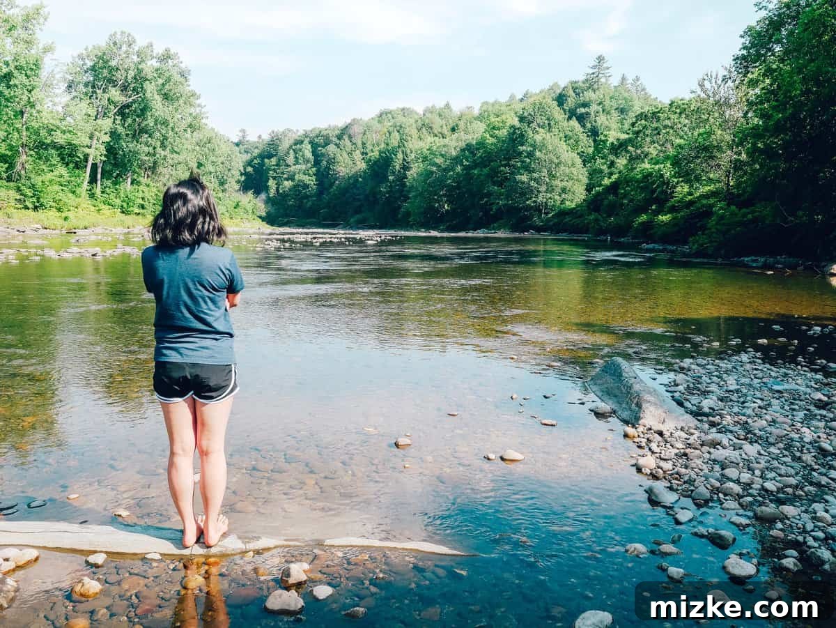 Your Ultimate Guide to Woodstock Vermont 3 The White River in Vermont with lush green banks and clear water
