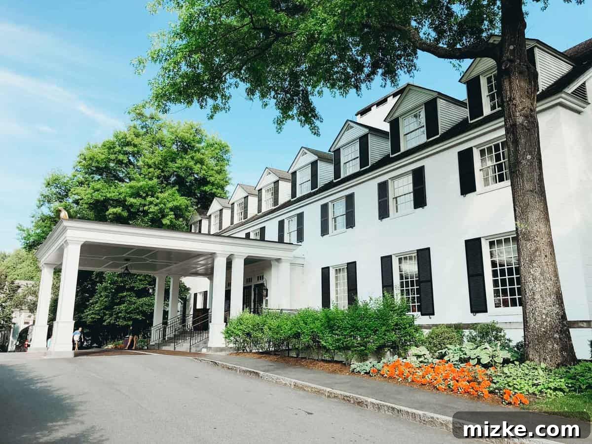 Your Ultimate Guide to Woodstock Vermont 4 Grand exterior of The Woodstock Inn and Resort amidst lush greenery