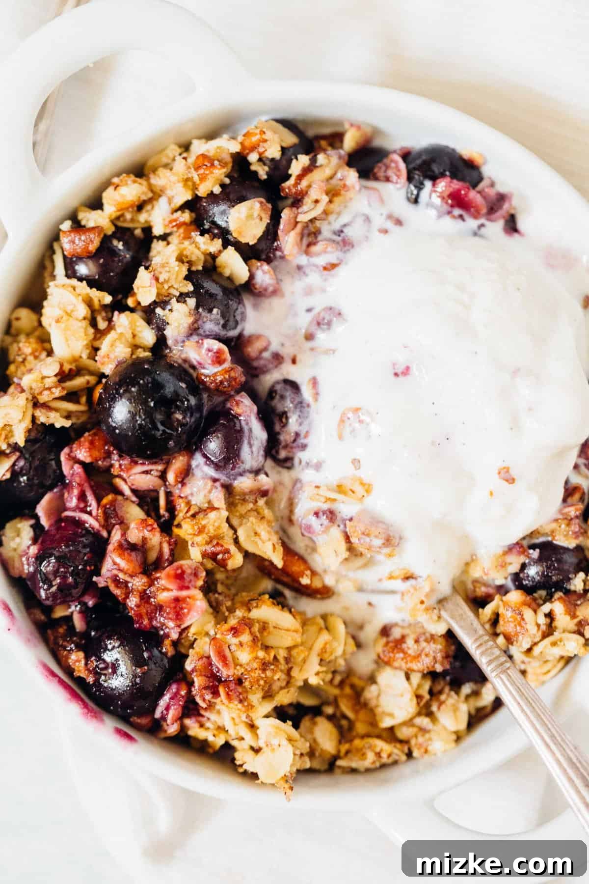 Effortless Blueberry Pecan Crumble: The Ultimate Dessert for Dinner Parties and Gatherings A large baking dish filled with blueberry pecan crumble, showcasing its golden brown topping.