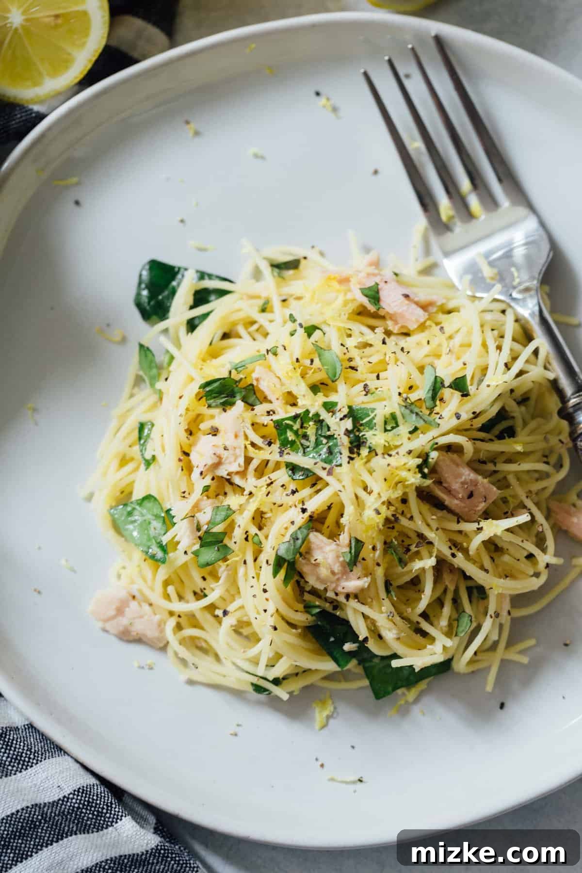 Sunshine Tuna Pasta 5 All the simple, fresh ingredients for zesty tuna pasta meticulously laid out on a clean kitchen counter.