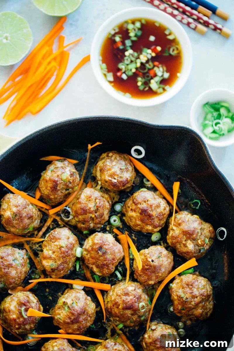 Frozen Asian Pork Meatballs for Easy Meal Prep Raw Asian pork meatballs, perfectly portioned and ready for freezing to simplify future meal preparations.