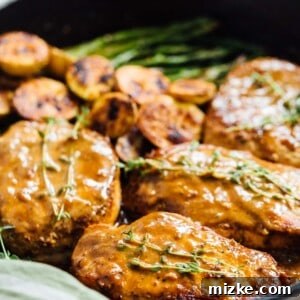 Apricot balsamic pork chops are going to be in your weeknight dinner rotation after your first bite of this sweet and tangy dish! #apricotbalsamic #apricot #porkchops #quickdinner #easydinner #skilletdinner