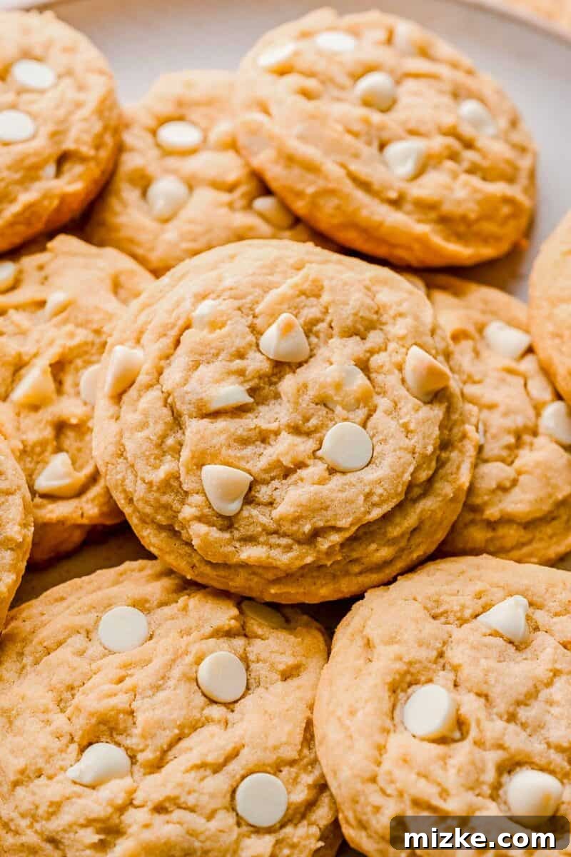 Heavenly White Chocolate Chip Cookies 4 A perfectly baked white chocolate chip cookie with melty white chocolate pieces on top.