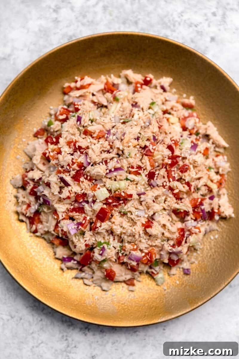 Vibrant Thai Tuna Salad 6 A gorgeously presented overview of the complete Thai Tuna Salad, nestled in a serving bowl and garnished with a generous sprinkle of sesame seeds, highlighting its fresh ingredients.