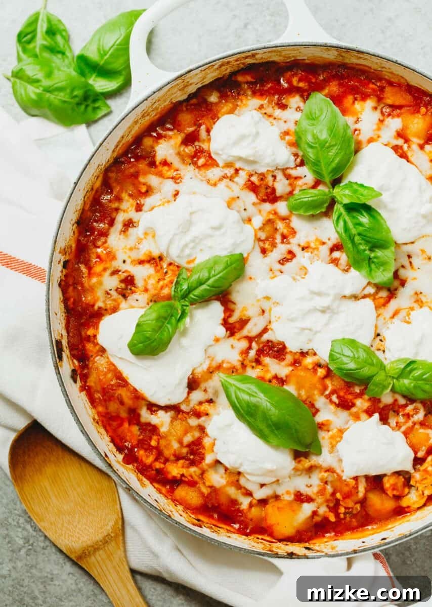 An easy dinner idea is this low-carb chicken parmesan gnocchi bake that is put together in one skillet! A great way to use that cauliflower gnocchi if you need ideas on how to use it! An easy and flavorful low-carb chicken parmesan gnocchi bake cooked in a single skillet, featuring tender chicken and cauliflower gnocchi.