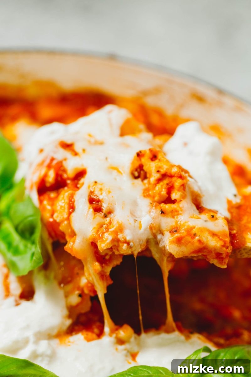An easy dinner idea is this low-carb chicken parmesan gnocchi bake that is put together in one skillet! A great way to use that cauliflower gnocchi if you need ideas on how to use it! A hearty and cheesy low-carb chicken parmesan gnocchi bake, a perfect easy dinner solution for using cauliflower gnocchi.