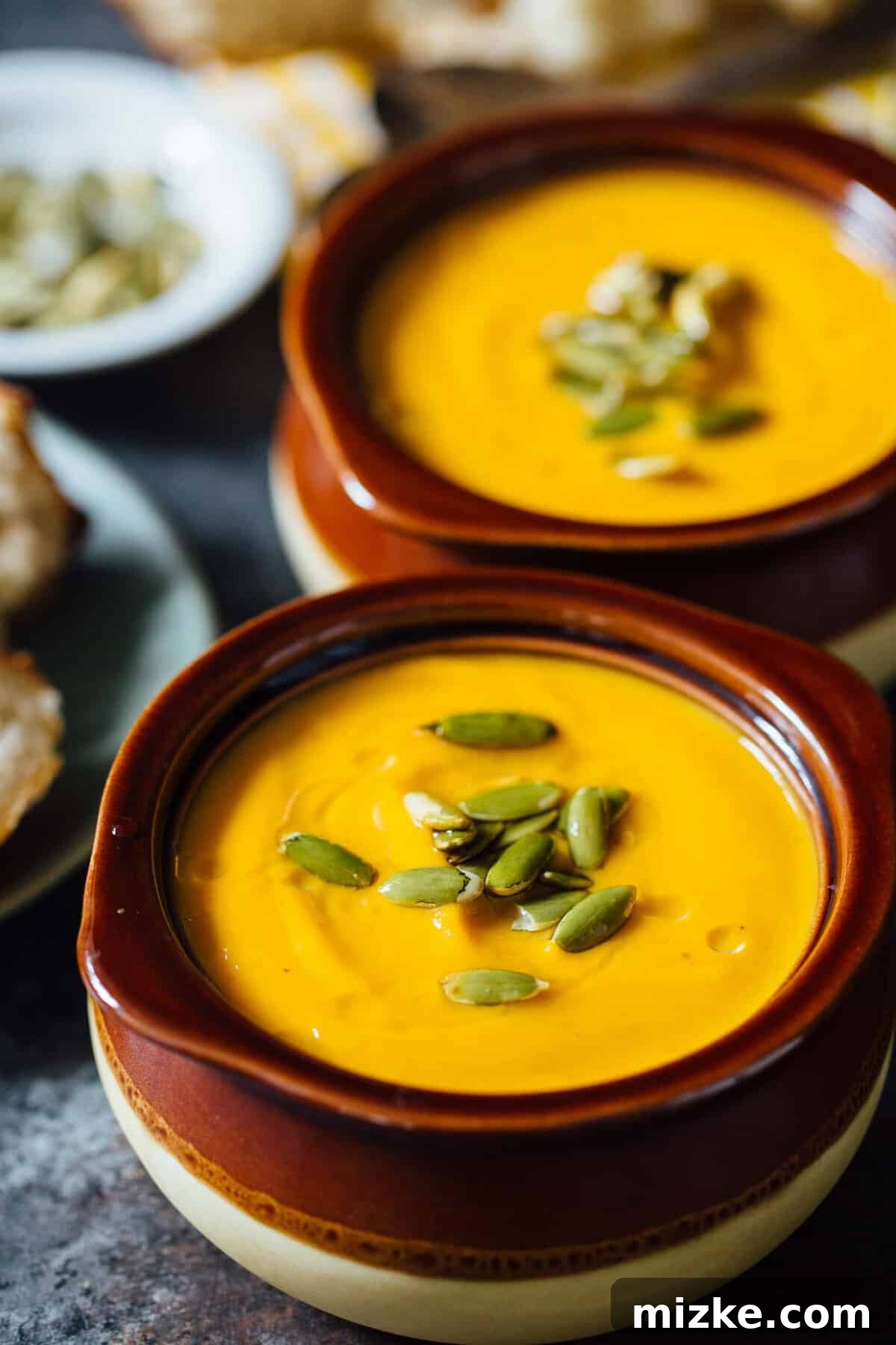 Velvety Butternut Squash Soup Texture Close-up of the smooth, creamy texture of Instant Pot Autumn Harvest Butternut Squash Soup, demonstrating its velvety perfection.