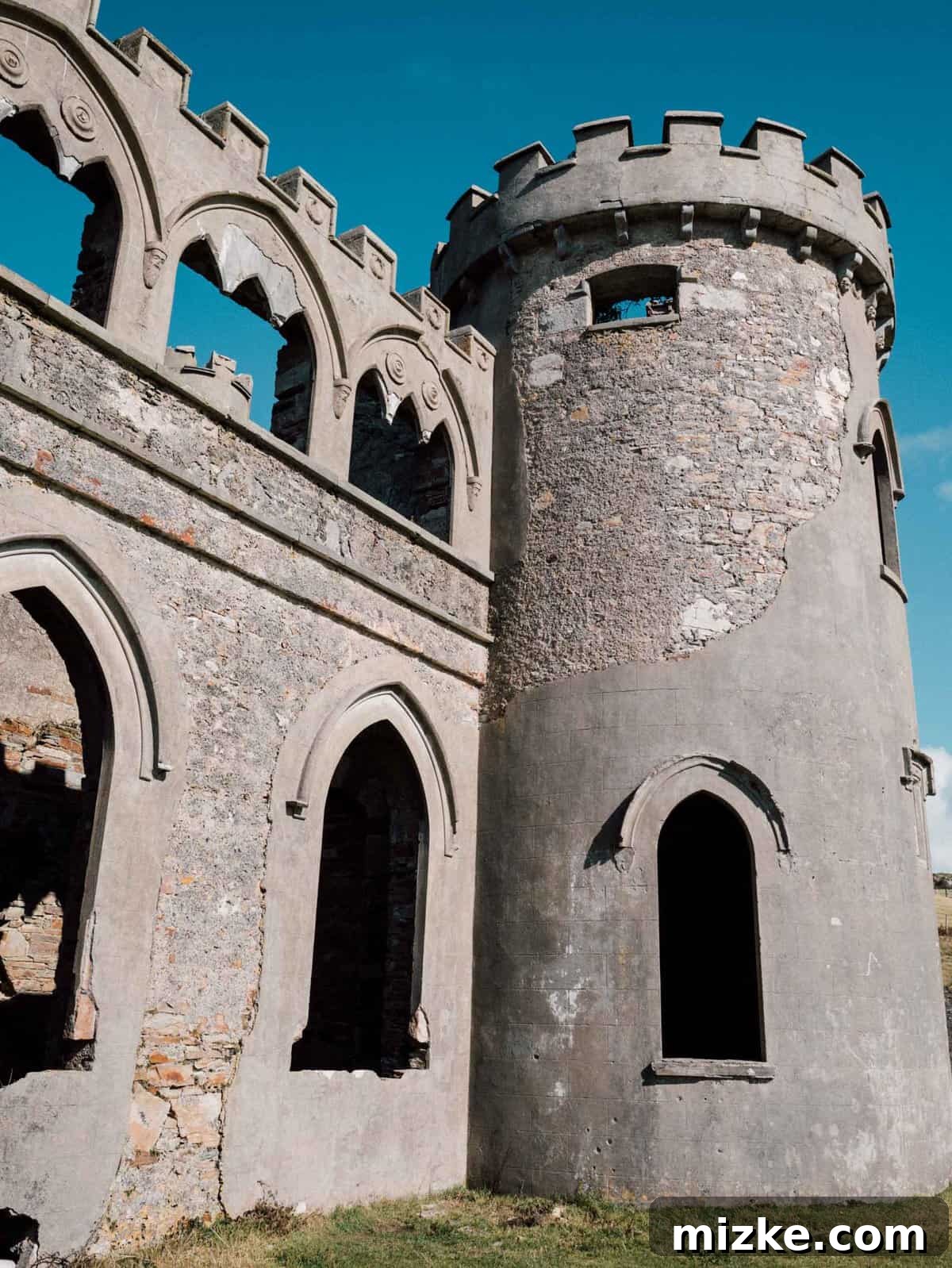 Exploring the Historic Ruins of Clifden Castle Ancient stone ruins of Clifden Castle nestled in the Connemara landscape