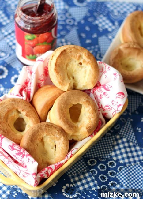 Popover Perfection 4 A close-up of fluffy popovers, showing their light and airy texture and golden interior