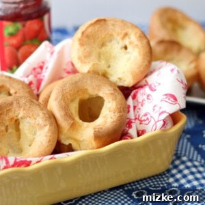 Popover Perfection 6 Perfectly risen popovers in a muffin tin, fresh from the oven, ready to be enjoyed