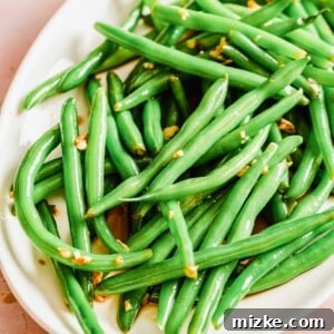 A delicious bowl of Cold Garlic and Soy Green Beans, ready to serve.