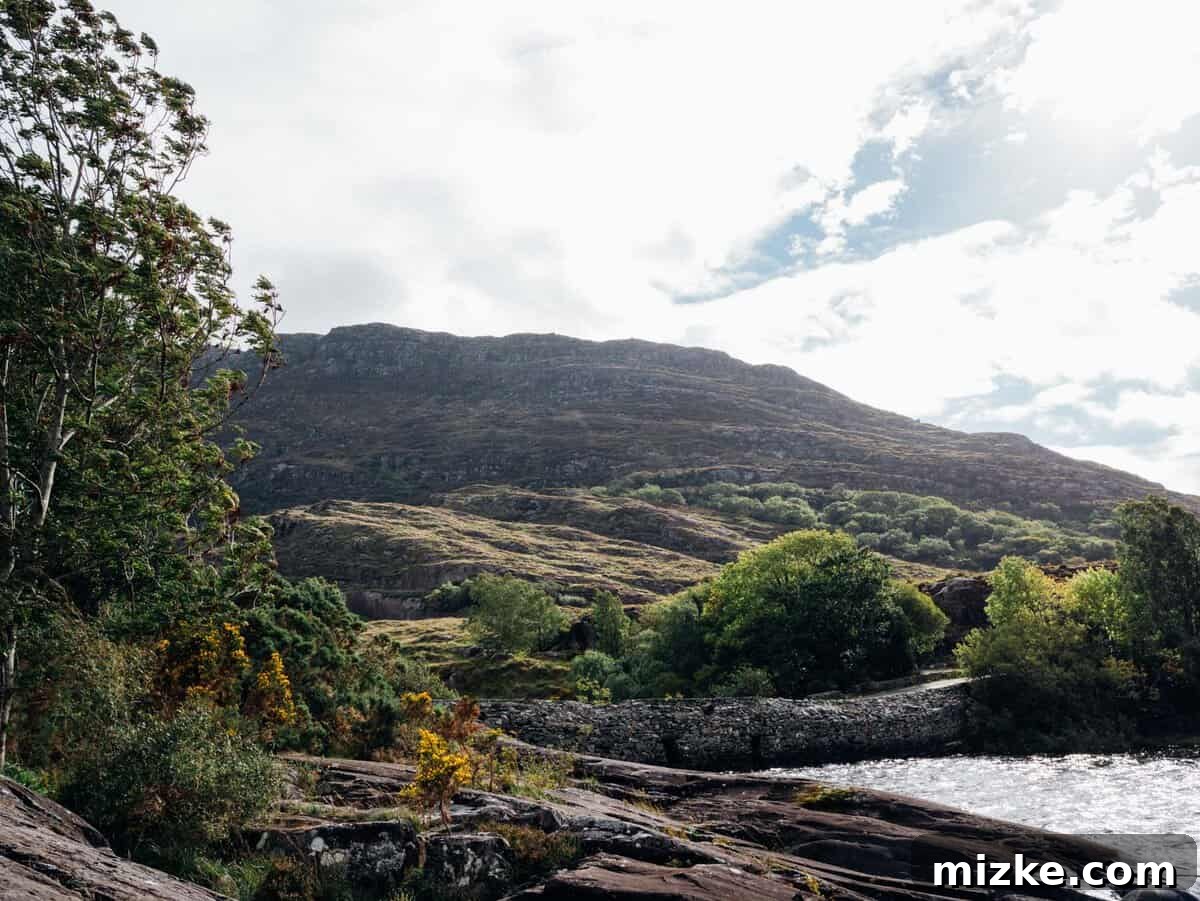 Killarney: Ireland's Emerald Gem 12 Mist-covered mountain peaks rising above a lush green valley in the Irish countryside