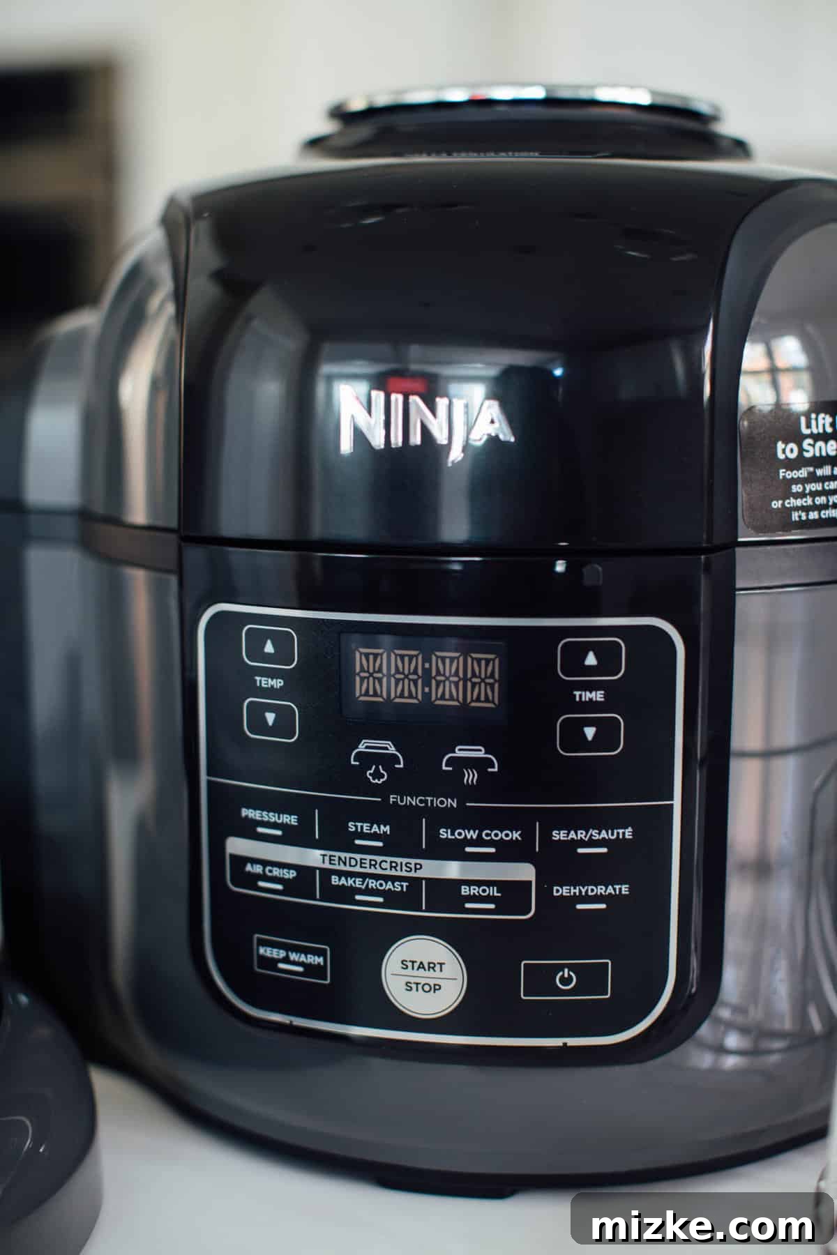 Instant Pot Versus Ninja Foodi 6 Ninja Foodi with dehydrator button visible on the control panel