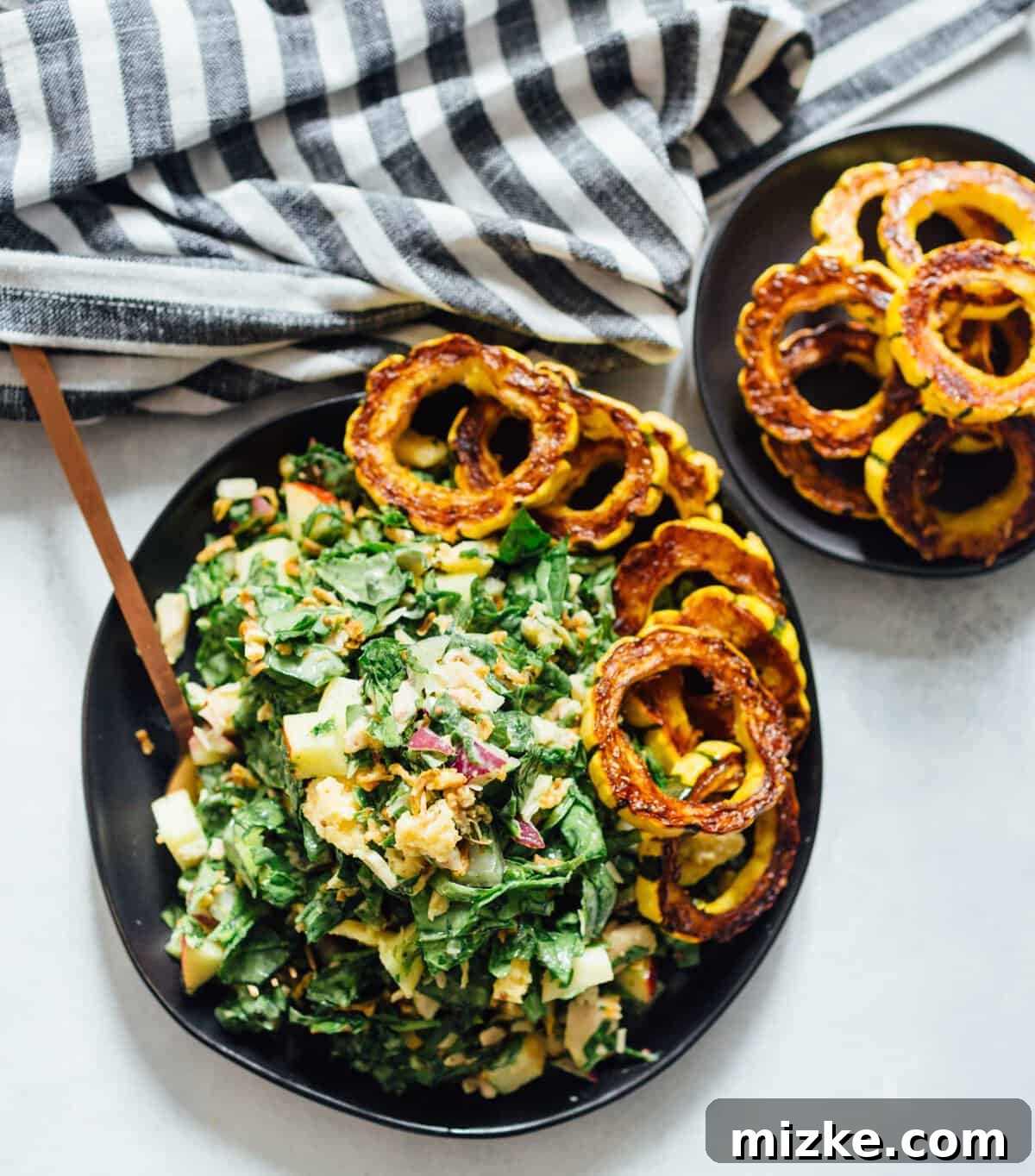 A spinach tuna salad topped with roasted delicata squash is a heavenly combination! The delicata squash gives it a unique yet distinct sweetness but it also adds volume to make this salad hearty and filling! This vibrant spinach tuna salad, adorned with perfectly roasted delicata squash, is an absolute delight for the senses. The delicata squash brings a unique, subtle sweetness and adds significant volume, making this salad wonderfully hearty and exceptionally filling.