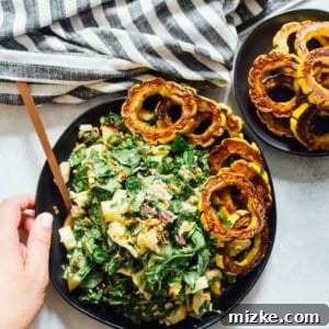 A large bowl of Spinach Tuna Salad with Delicata Squash