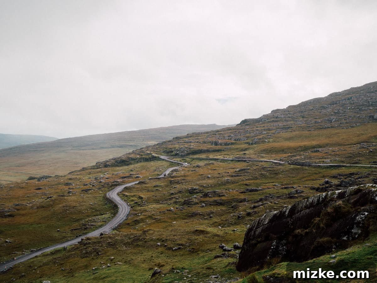 Ireland's Rugged Beara Peninsula 27 Panoramic view from the summit of Healy Pass, showcasing vast mountain ranges and valleys
