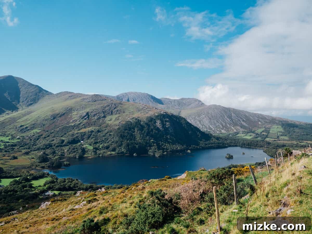 Ireland's Rugged Beara Peninsula 34 Majestic view of a deep valley with dramatic lighting as sun breaks through clouds