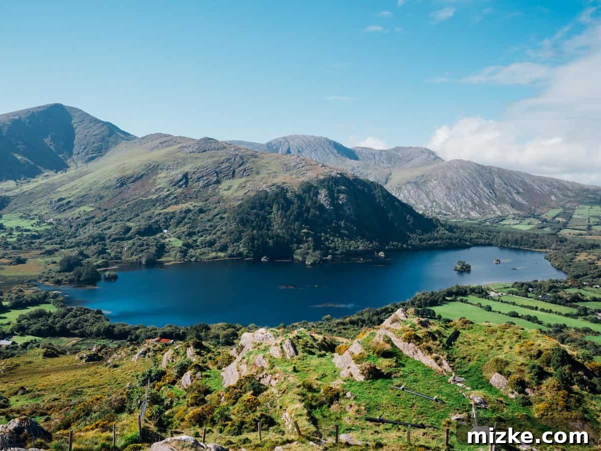 Ireland's Rugged Beara Peninsula 36 Rural Irish landscape with a farmhouse nestled in a valley, surrounded by green fields