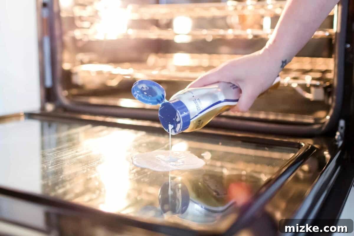 Achieve a mirror finish on your oven door with this simple, step-by-step cleaning hack. Say goodbye to stubborn grime! Step-by-step guide to cleaning your glass oven door for a mirror finish using a razor scraper and Bar Keepers Friend. This oven cleaning hack is incredibly effective.