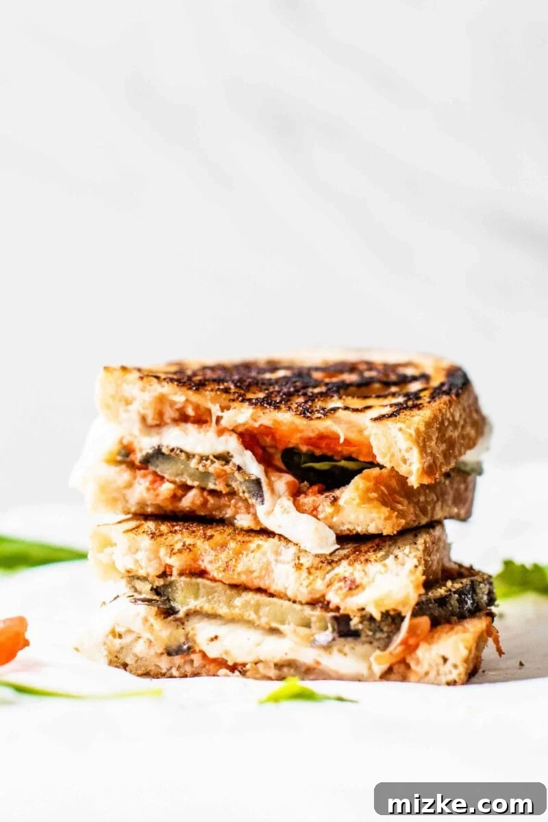 Homemade Crispy Eggplant Parmesan Sandwich A delicious, crispy Eggplant Parmesan Sandwich with melted cheese and fresh basil, a perfect alternative to traditional eggplant parm.